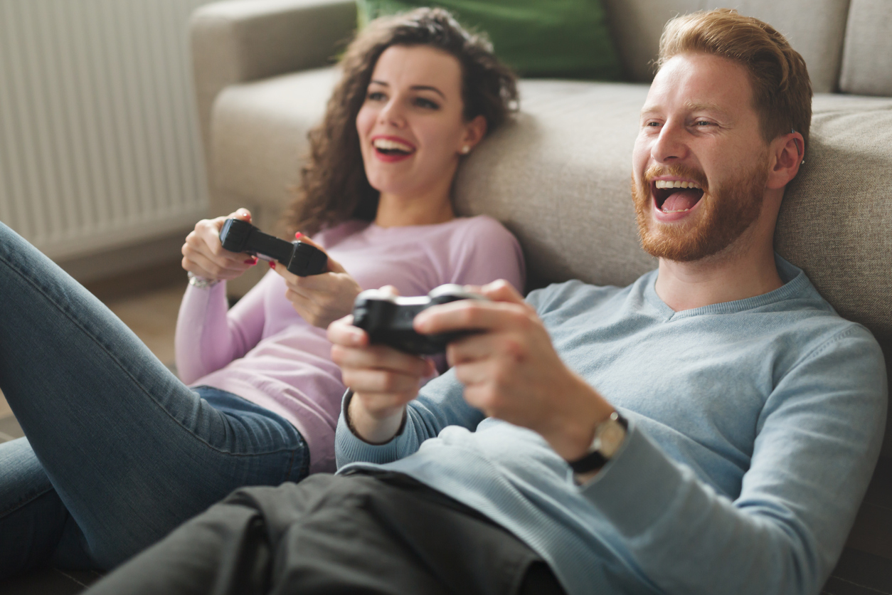 couple playing video games on console