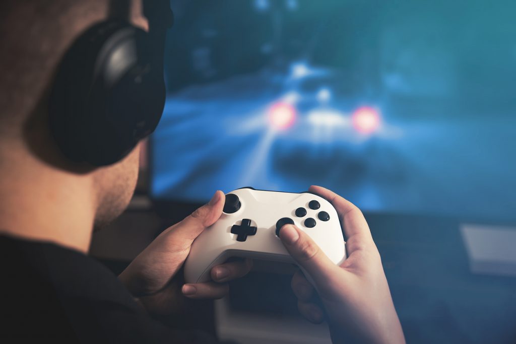 Gaming using wireless headphones and a games console connected to a TV