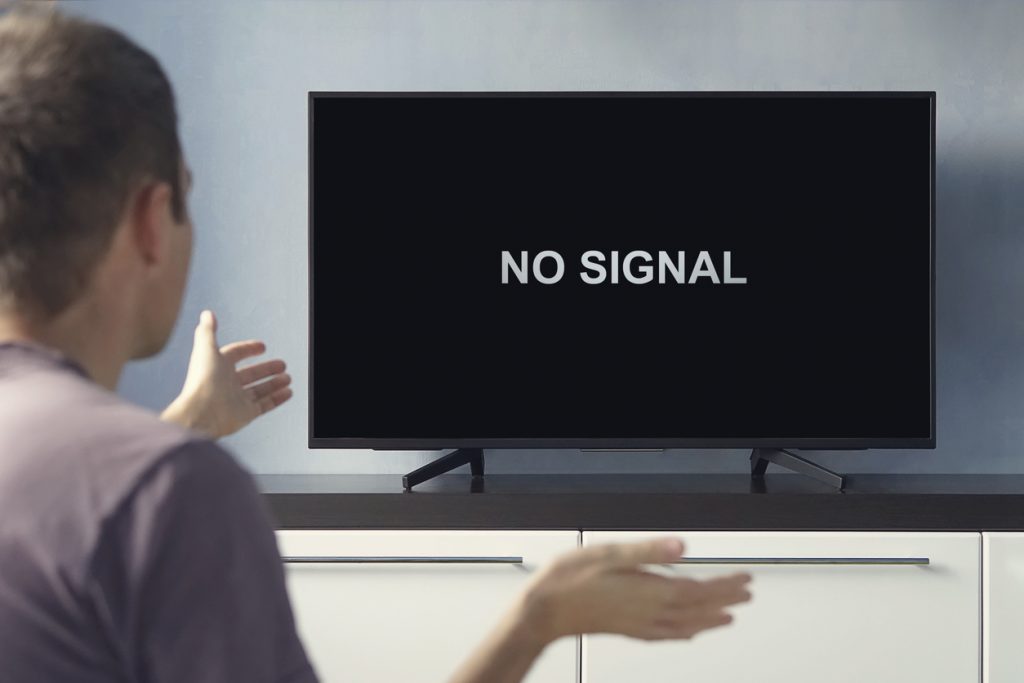 Man with no signal on his TV