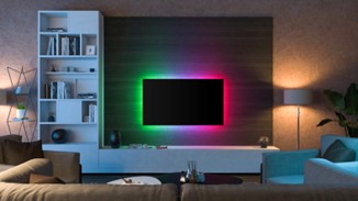 A tv on a wall with colourful lights