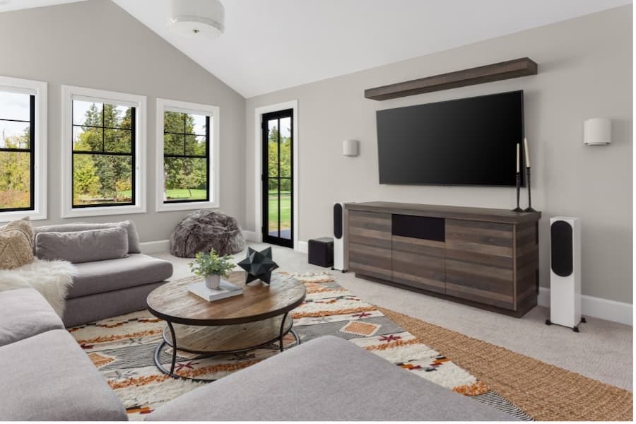 A living room with a television on the wall